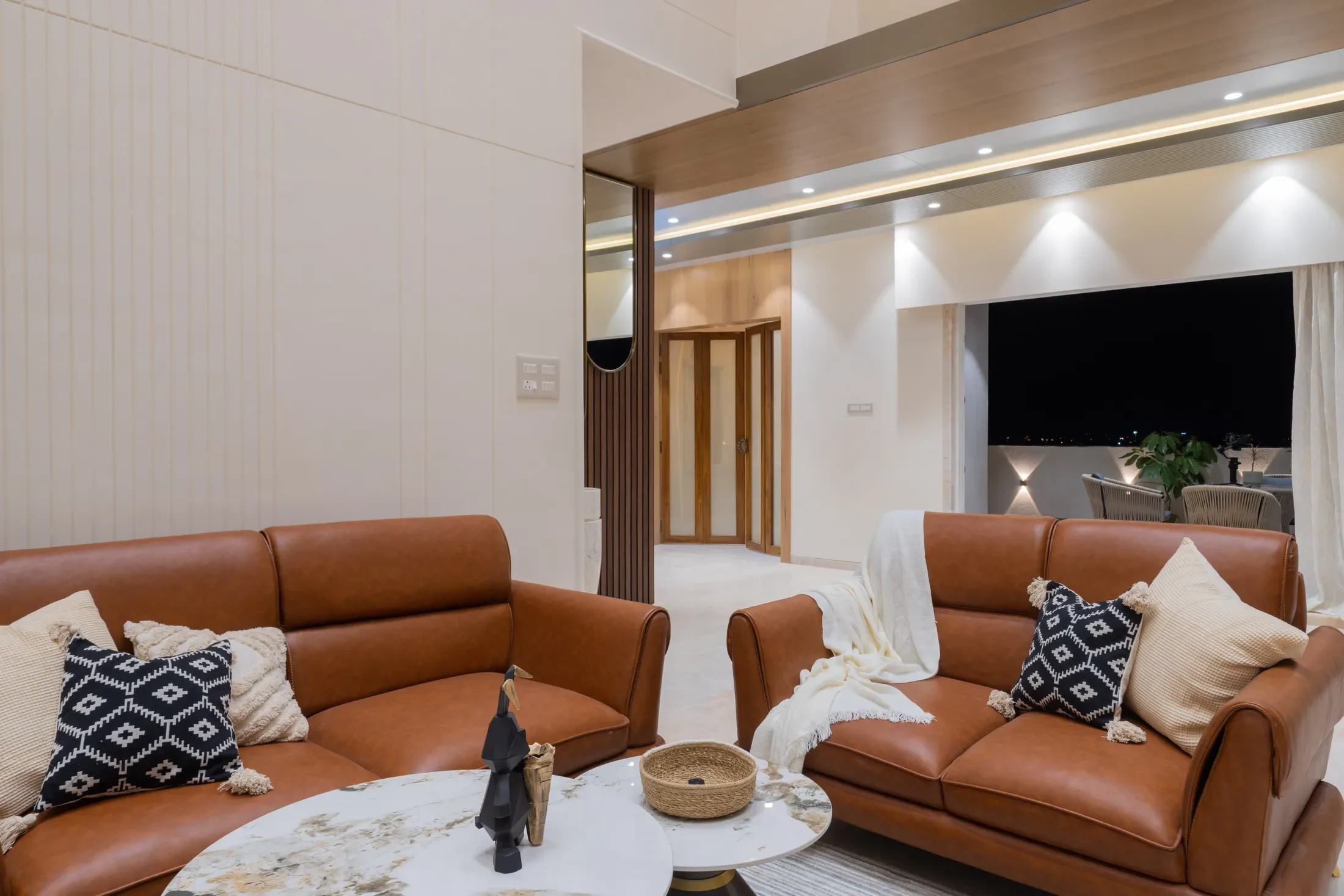 Open living and dining with a warm wood ceiling