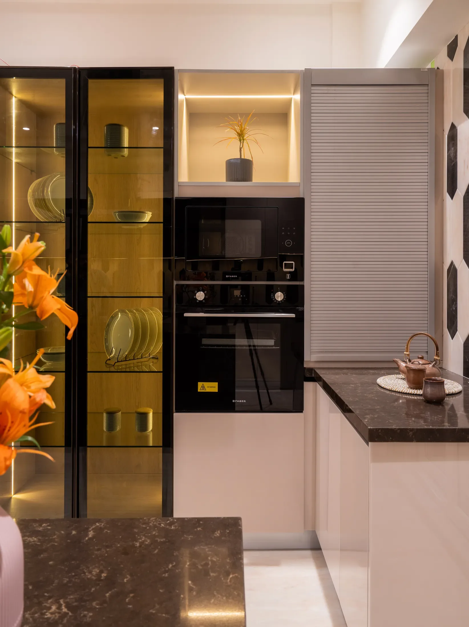 Kitchen with a brass-fronted display and stone
