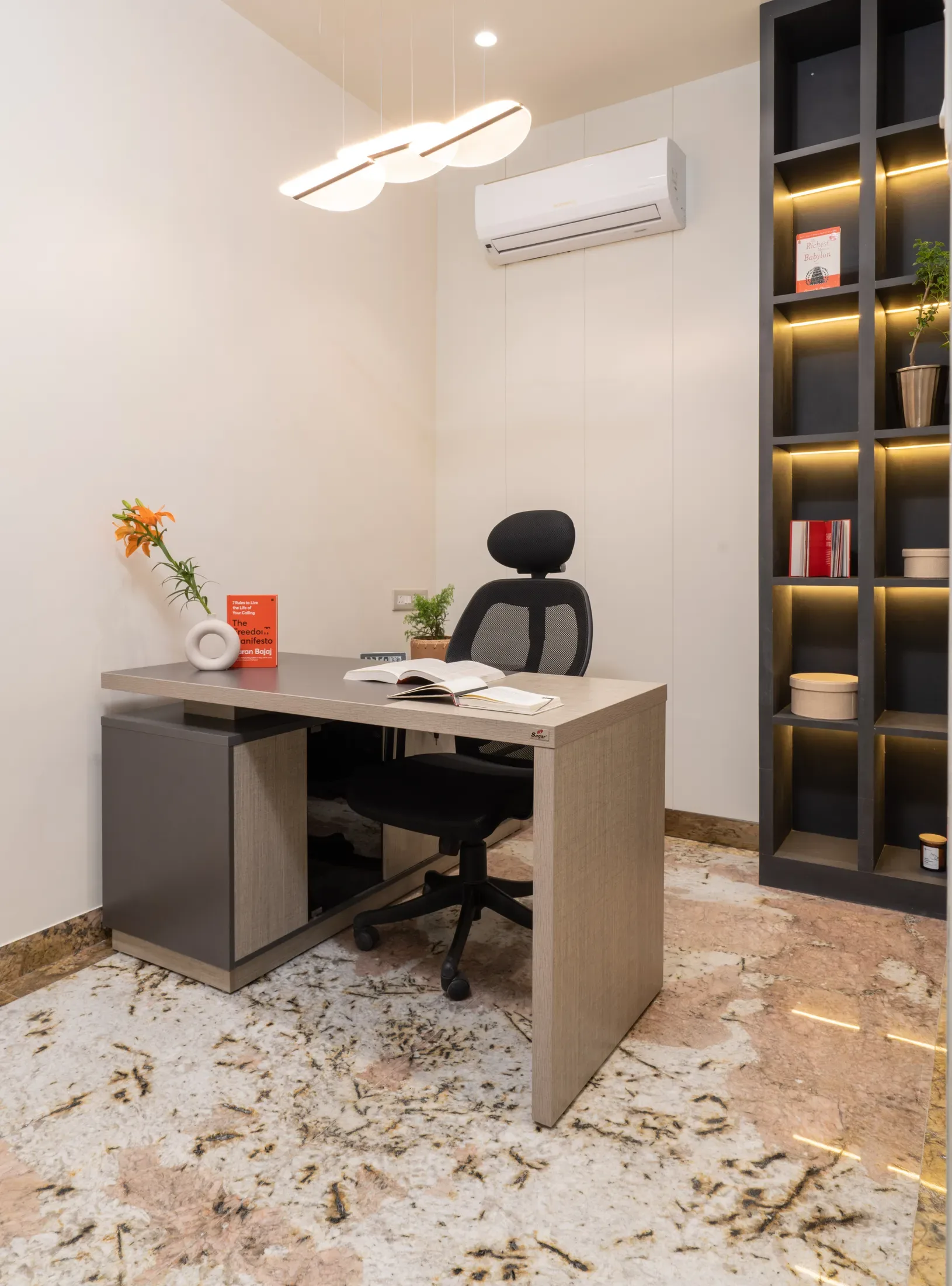 Private office with a walnut desk and a city view