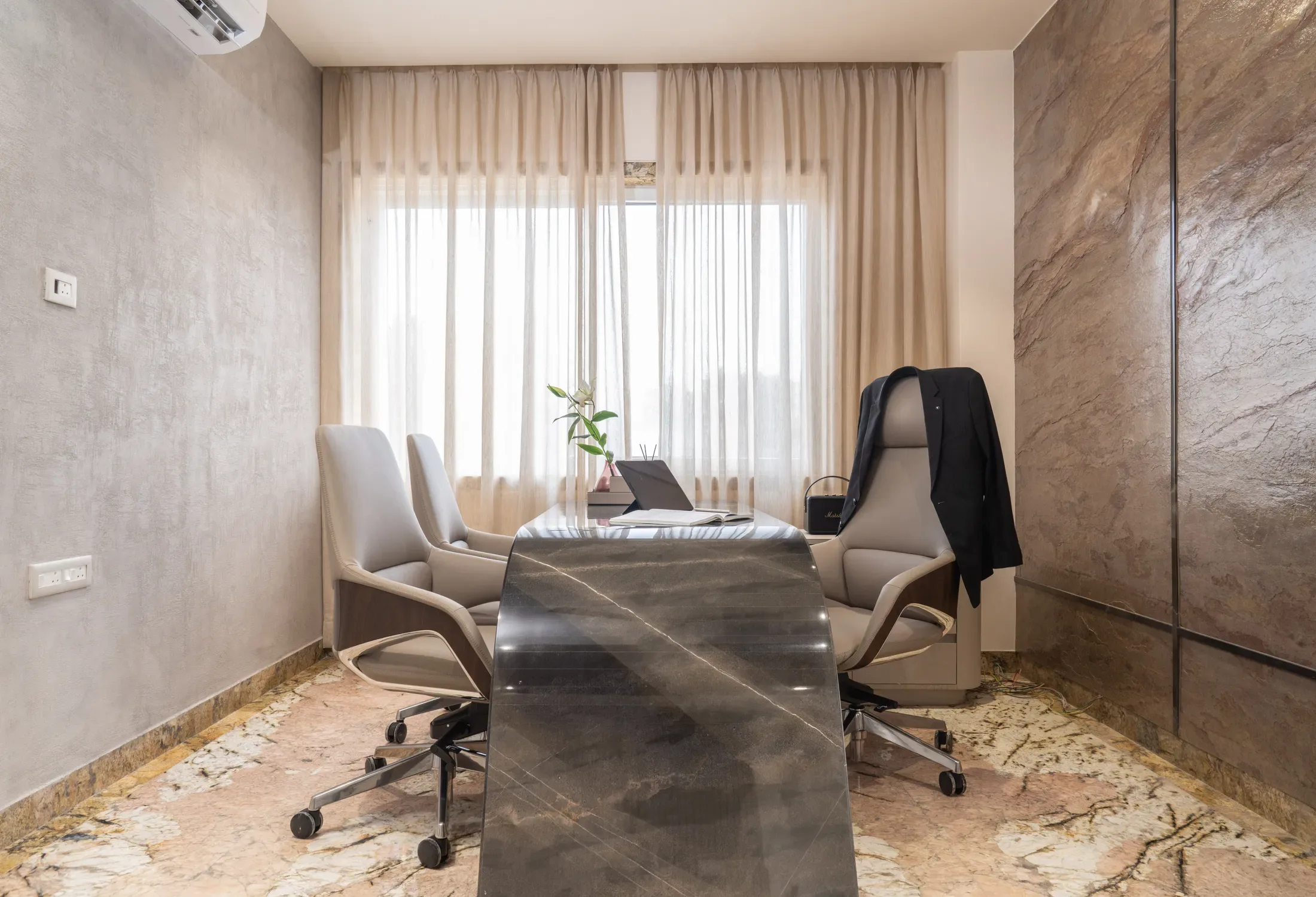 Glass-fronted rooms and open desks